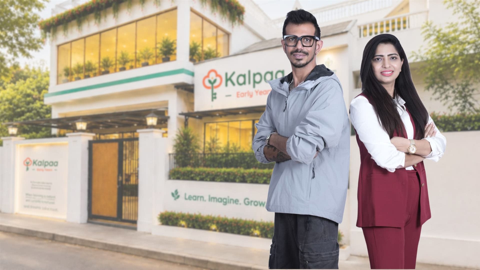 Yuzvendra Chahal and a colleague standing arms crossed outside a Kalpaa Early Years centre